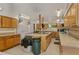 Spacious kitchen featuring wooden cabinets, large island, and lots of countertop space at 9860 62Nd N Ter # 1047, St Petersburg, FL 33708