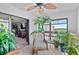 Relaxing lanai featuring wicker seating, a ceiling fan, and views, perfect for enjoying the outdoors at 9860 62Nd N Ter # 1047, St Petersburg, FL 33708
