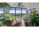 Inviting lanai with comfortable seating, adorned with lush greenery and offering serene views at 9860 62Nd N Ter # 1047, St Petersburg, FL 33708
