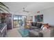 Cozy living room with comfortable seating, stylish decor, and sliding glass doors leading to the lanai at 9860 62Nd N Ter # 1047, St Petersburg, FL 33708