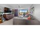 Spacious living room with a comfortable gray sofa, large windows, and stylish decor at 9860 62Nd N Ter # 1047, St Petersburg, FL 33708