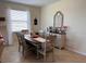 Dining area with a table for six and a buffet for storage at 13642 Newport Shores Dr, Hudson, FL 34669