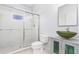 Modern bathroom featuring glass enclosed shower and vessel sink on a custom vanity at 15340 Alsask Cir, Port Charlotte, FL 33981