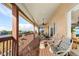 Expansive covered deck with telescope and water views, perfect for outdoor relaxation and entertainment at 15340 Alsask Cir, Port Charlotte, FL 33981