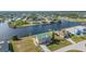 Waterfront home with a green roof, canal access, and well-maintained landscaping at 15340 Alsask Cir, Port Charlotte, FL 33981