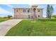 Charming two-story home with a well-manicured lawn and inviting curb appeal at 15340 Alsask Cir, Port Charlotte, FL 33981