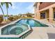 Inviting outdoor pool and spa area for relaxing and entertaining near the waterway at 15340 Alsask Cir, Port Charlotte, FL 33981