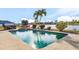 Sparkling pool and spa with views of the waterfront, offering a serene and picturesque outdoor oasis at 15340 Alsask Cir, Port Charlotte, FL 33981