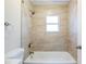 Clean bathroom includes a bathtub, tiled shower, and modern fixtures, creating a relaxing space at 1769 Dayton S St, St Petersburg, FL 33712