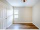 Bright bedroom with new flooring, a ceiling fan, and a white door, offering a cozy retreat at 1769 Dayton S St, St Petersburg, FL 33712