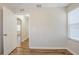 Empty bedroom with wood-look floors and a door that looks onto the hallway at 1769 Dayton S St, St Petersburg, FL 33712
