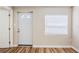 Inviting entryway features wood-look floors, white trim, and a decorative glass door at 1769 Dayton S St, St Petersburg, FL 33712
