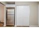 A spacious kitchen showcasing a stainless steel refrigerator and ample storage with closet doors at 1769 Dayton S St, St Petersburg, FL 33712