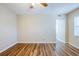 Open-concept living room featuring wood-look floors and abundant natural light at 1769 Dayton S St, St Petersburg, FL 33712