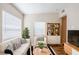 Cozy living room with modern furniture, natural light, and decorative shelving at 1769 Dayton S St, St Petersburg, FL 33712