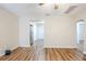 Open-concept living room with wood-look floors that connects seamlessly to the kitchen at 1769 Dayton S St, St Petersburg, FL 33712