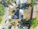 Aerial view of a well-maintained home with a spacious backyard and a screened enclosure at 2601 Bridle Dr, Plant City, FL 33566