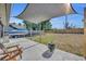 Comfortable backyard patio with grill and shade sails, ideal for outdoor living and enjoying the weather at 2601 Bridle Dr, Plant City, FL 33566