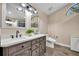 Bathroom featuring a dual sink vanity, granite countertops, and tiled floors at 2601 Bridle Dr, Plant City, FL 33566
