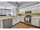 Well lit kitchen featuring stainless steel appliances, tiled back splash, and a breakfast bar at 2601 Bridle Dr, Plant City, FL 33566