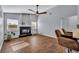 Living room with fireplace, vaulted ceilings, and hardwood style flooring at 2601 Bridle Dr, Plant City, FL 33566