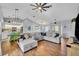 Bright living room with hardwood floors, open layout, and an inviting seating area at 2601 Bridle Dr, Plant City, FL 33566
