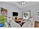 Spacious living room featuring wood floors, a large sectional sofa, and sliding glass doors at 2601 Bridle Dr, Plant City, FL 33566