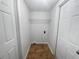 Spacious walk in closet with tile flooring and wire shelving ready to organize your belongings at 4432 W Wallace Ave, Tampa, FL 33611