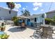 Charming backyard patio with outdoor seating, perfect for entertaining and relaxing under the sun at 8407 Interbay Blvd, Tampa, FL 33616