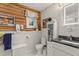 Bright bathroom featuring white shiplap walls and a modern vanity at 8407 Interbay Blvd, Tampa, FL 33616