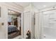 Bathroom connected to bedroom, featuring a shower with a curtain at 8407 Interbay Blvd, Tampa, FL 33616