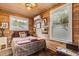 Wood-paneled bedroom with natural light and unique wall decor at 8407 Interbay Blvd, Tampa, FL 33616