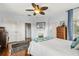 Bedroom features hardwood floors, natural light, and classic decor for a relaxing retreat at 8407 Interbay Blvd, Tampa, FL 33616