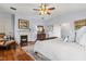 Spacious bedroom with hardwood floors, fireplace, and ornate accents offers a cozy and inviting atmosphere at 8407 Interbay Blvd, Tampa, FL 33616