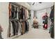 Walk-in closet with custom shelving and plenty of room for storage and organization at 8407 Interbay Blvd, Tampa, FL 33616
