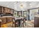 Charming dining area with dark cabinets, patterned walls, and a stylish chandelier at 8407 Interbay Blvd, Tampa, FL 33616