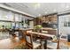 Spacious dining area open to the kitchen with hardwood floors and stylish decor at 8407 Interbay Blvd, Tampa, FL 33616