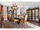 Bright formal dining room featuring an elegant chandelier, ornate furniture, and classic decor at 8407 Interbay Blvd, Tampa, FL 33616