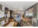 Open-concept kitchen with an island, hardwood floors, and stainless steel appliances at 8407 Interbay Blvd, Tampa, FL 33616