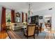 Cozy living room with hardwood floors, decorative rug, elegant furnishings, and natural light at 8407 Interbay Blvd, Tampa, FL 33616