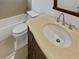 Well-lit bathroom featuring a marble vanity top, tub, and neutral-toned tile flooring at 11356 Callaway Pond Dr, Riverview, FL 33579