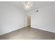 This bedroom features tile flooring, crown molding, and an open doorway at 11356 Callaway Pond Dr, Riverview, FL 33579