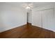 Bedroom featuring hardwood floors, closet and an ensuite bathroom at 11356 Callaway Pond Dr, Riverview, FL 33579