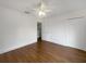 Bedroom featuring hardwood floors, closet and an ensuite bathroom at 11356 Callaway Pond Dr, Riverview, FL 33579
