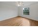 Bright bedroom features hardwood floors, crown molding, and a large window at 11356 Callaway Pond Dr, Riverview, FL 33579