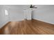 Spacious bedroom with hardwood floors and multiple doors, creating a bright atmosphere at 11356 Callaway Pond Dr, Riverview, FL 33579
