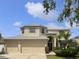 Charming two-story home with three car garage, manicured lawn and mature landscaping at 11356 Callaway Pond Dr, Riverview, FL 33579