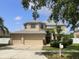 Charming two-story home with three car garage, manicured lawn and mature landscaping at 11356 Callaway Pond Dr, Riverview, FL 33579