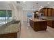 Gourmet kitchen featuring granite countertops, custom cabinetry and stainless steel appliances at 11356 Callaway Pond Dr, Riverview, FL 33579