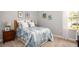 Comfortable bedroom showcases a light blue comforter, plush white pillows, and natural light from the window at 11456 Libby Rd, Spring Hill, FL 34609